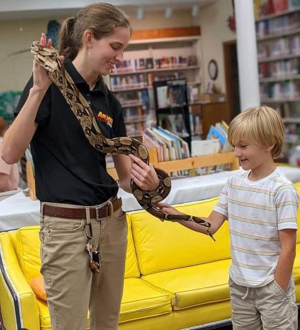 Picture of child with exotic animal